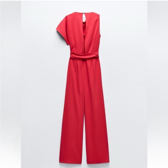 ASYMMETRIC CREPE BUCKLE JUMPSUIT
RED / CORAL . SIZE M, L - Picture 13 of 16